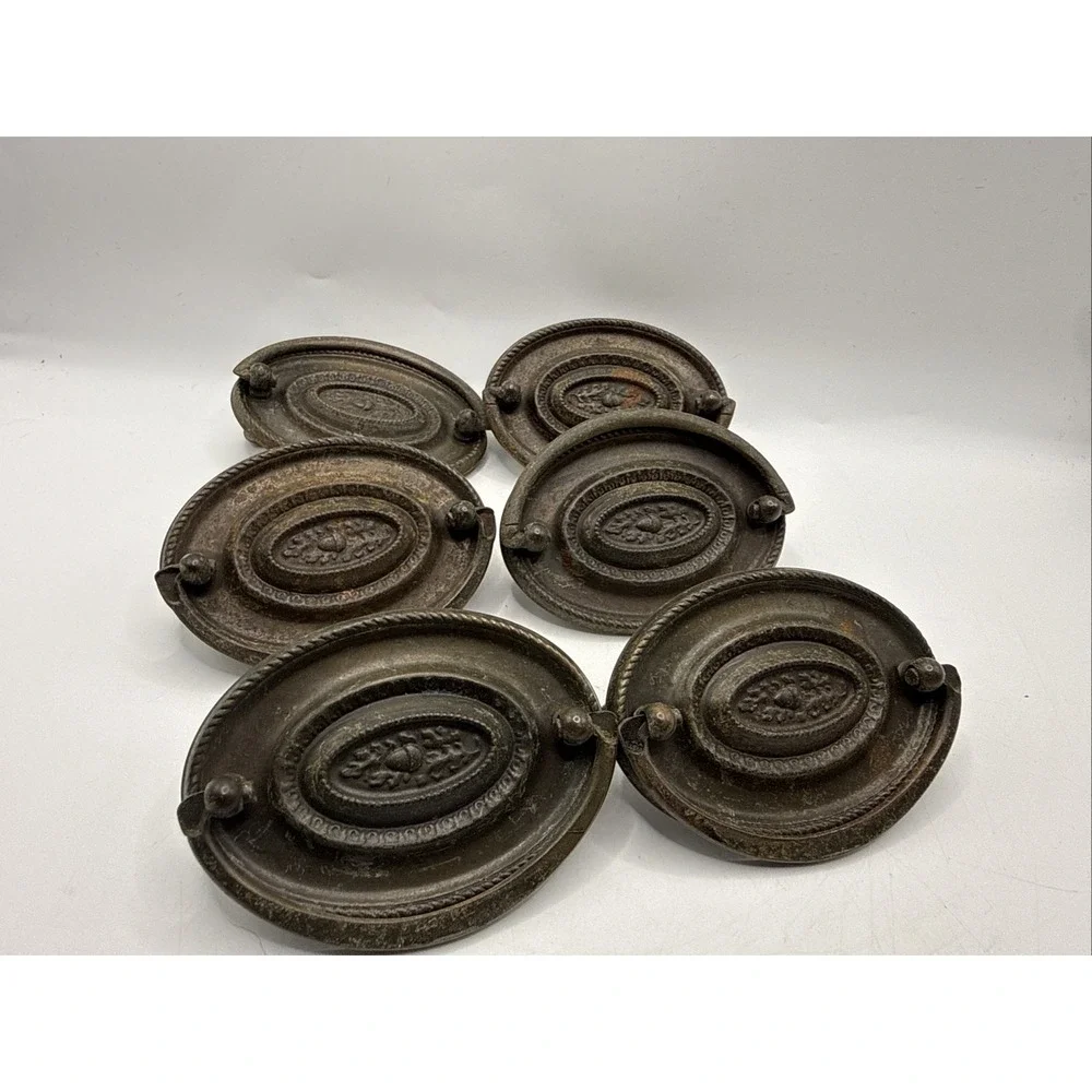 Antique Hepplewhite-style drawer pulls embossed oval backplate